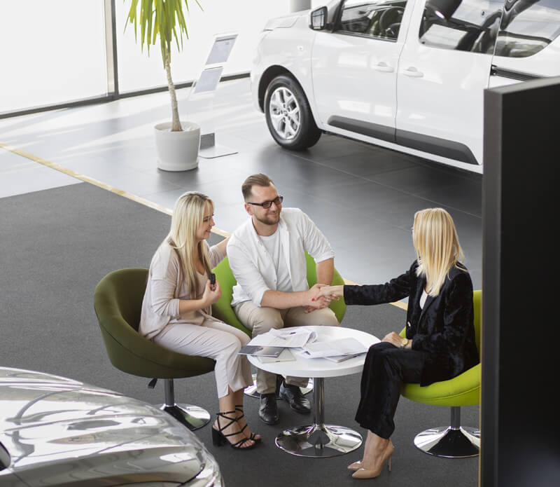 People meeting with dealership member
